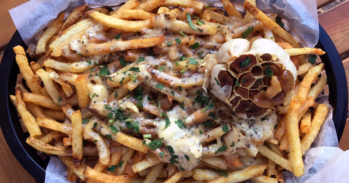 Shoe string french fries smothered by duck fat gravy