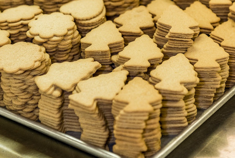 Stacks of Moravian cookies on a sheetpan