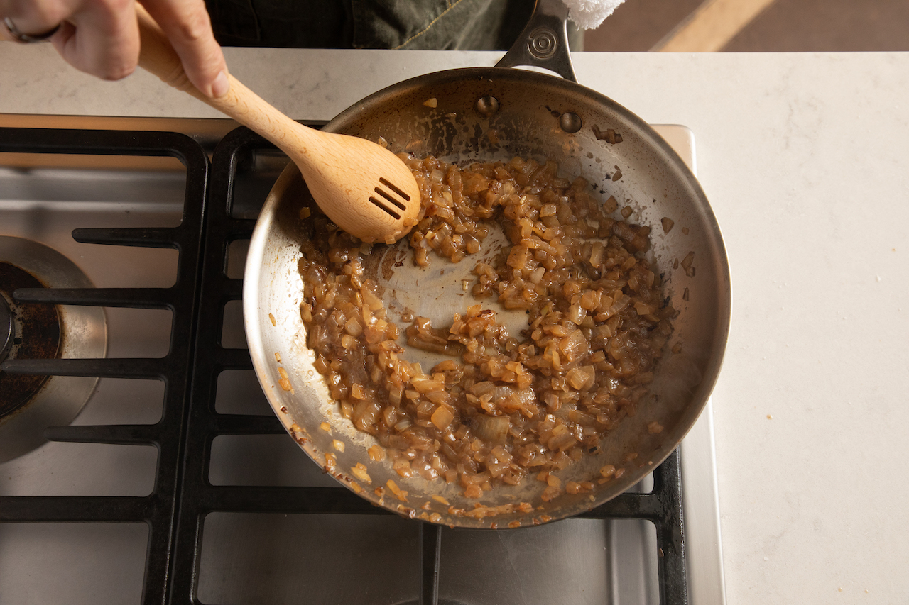 Deglazing the pan of onions for caramelized onion dip
