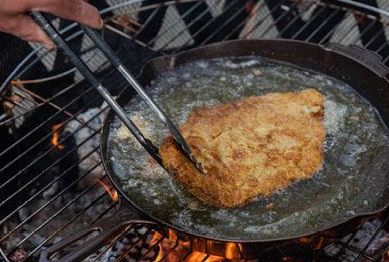 Image showing how to fry fish, where the fish is being cooked in a skillet with butter