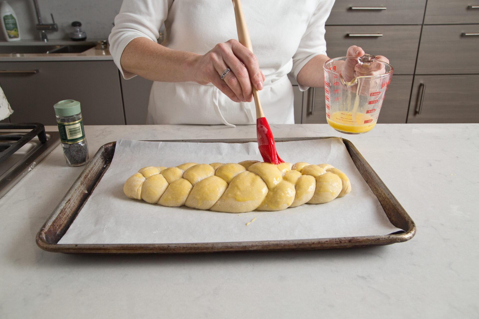 Challah Step 6: Brushing dough with eggwash