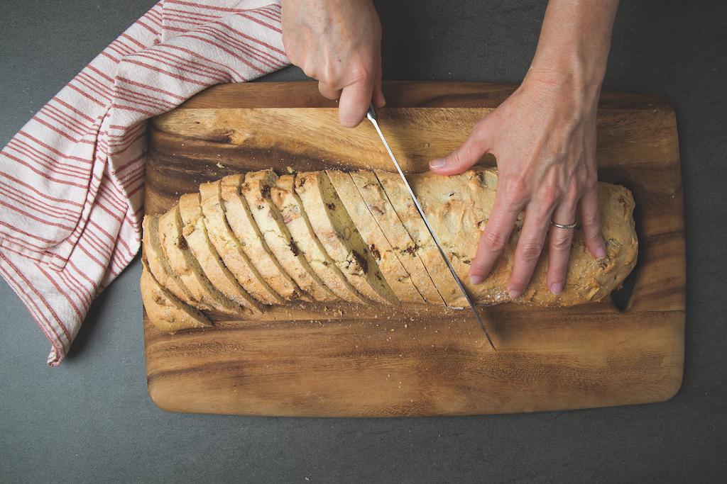 How to make biscotti step 4: Slice par-baked biscotti into small biscuits