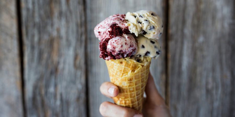 Homemade red velvet cake gelato and chocolate chip gelato, served in a waffle cone, make summer-ready Labor Day desserts