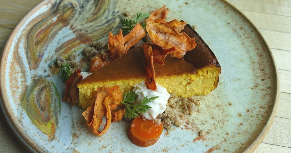 Carrot-goat cheese basque cheesecake on a plate