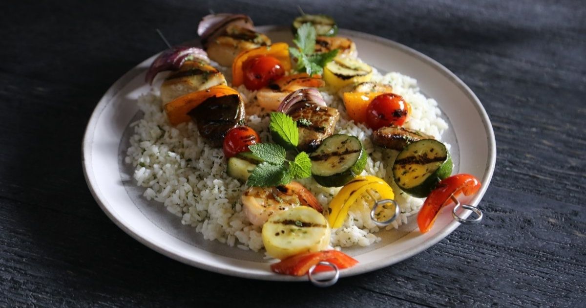 Skewers of grilled South Carolina vegetables over couscous