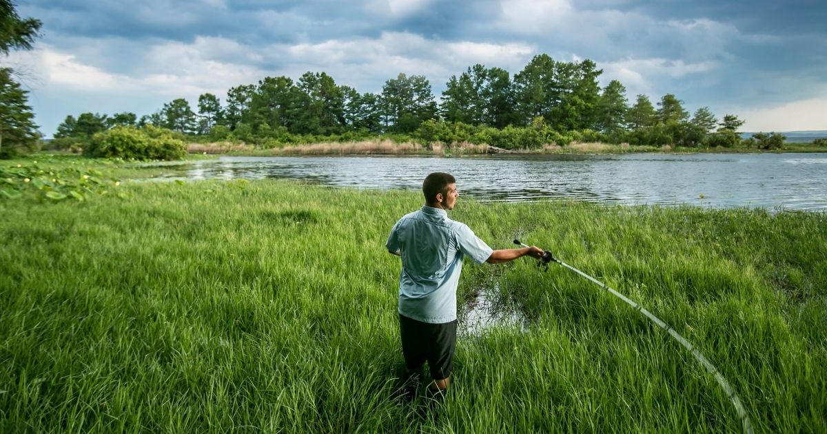 Man Fishing in the marsh of Toledo Bend Lake Country