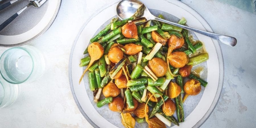 Bowl of asparagus, golden beet, and grilled scallion salad