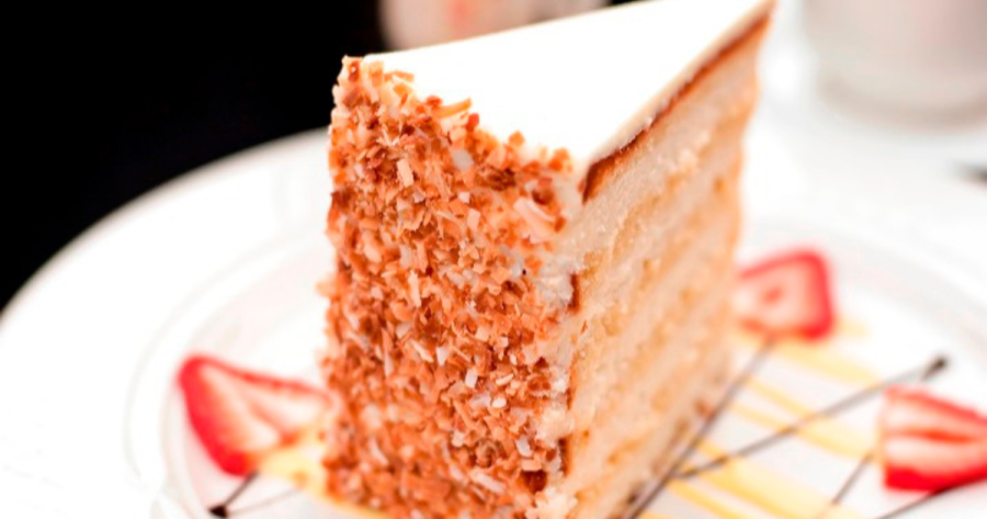 A slice of Peninsula Grill’s Ultimate Coconut Cake, one of June's most popular recipes