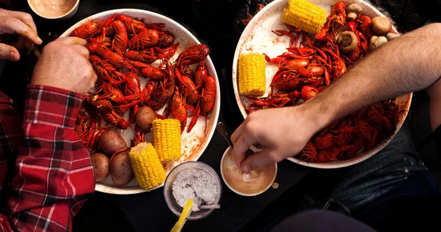 crawfish boil being shared across a table