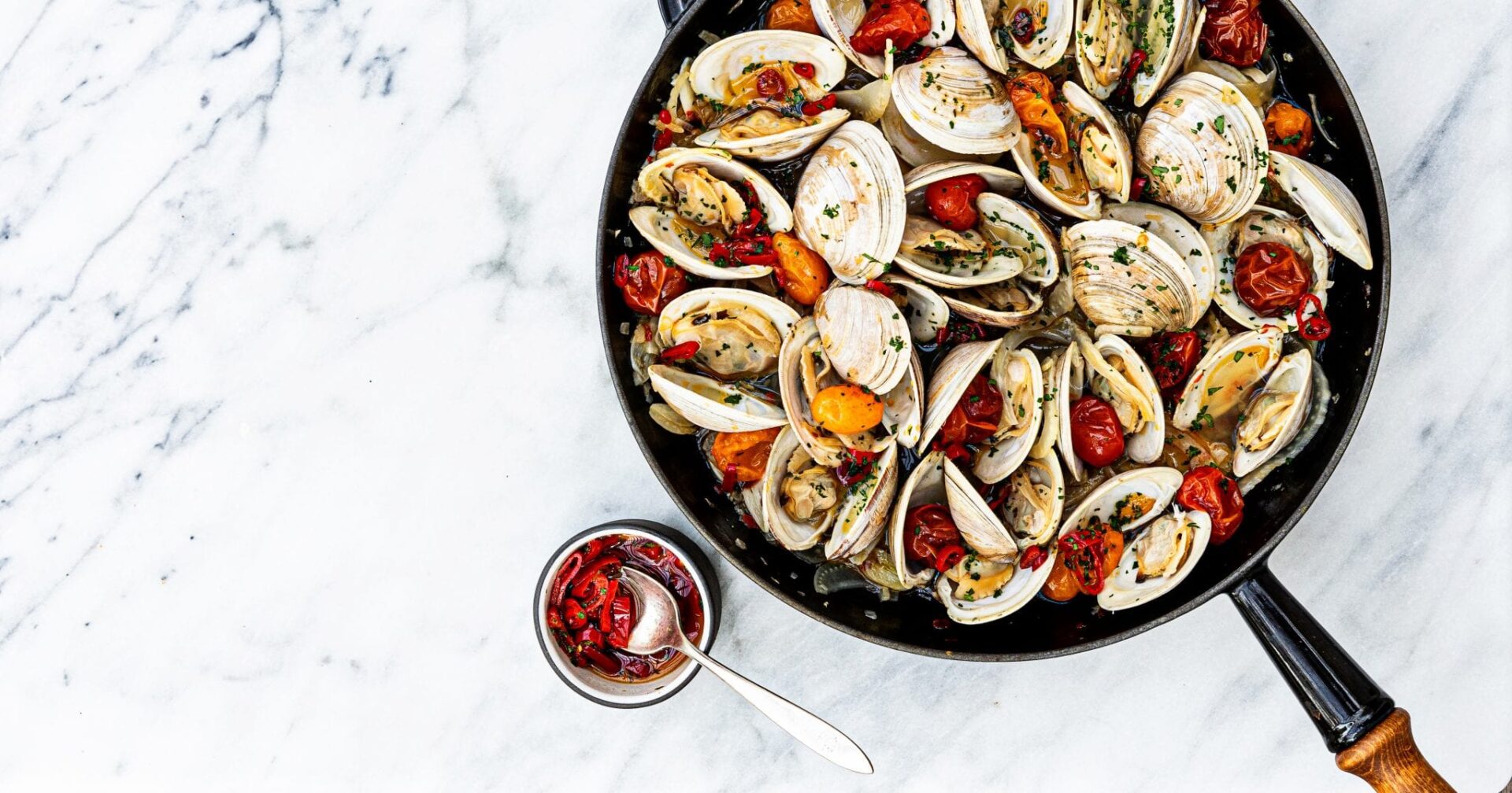 Calabrian style clams in a skillet