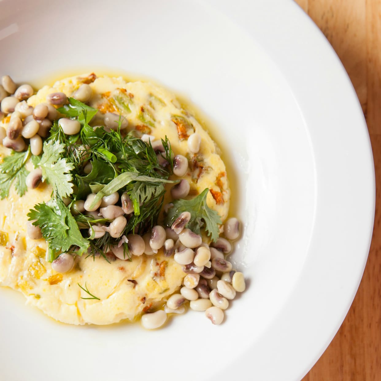 Squash Blossom Frittata with Field Peas and Herbs from Chef Chris Rainosek of The Noble South