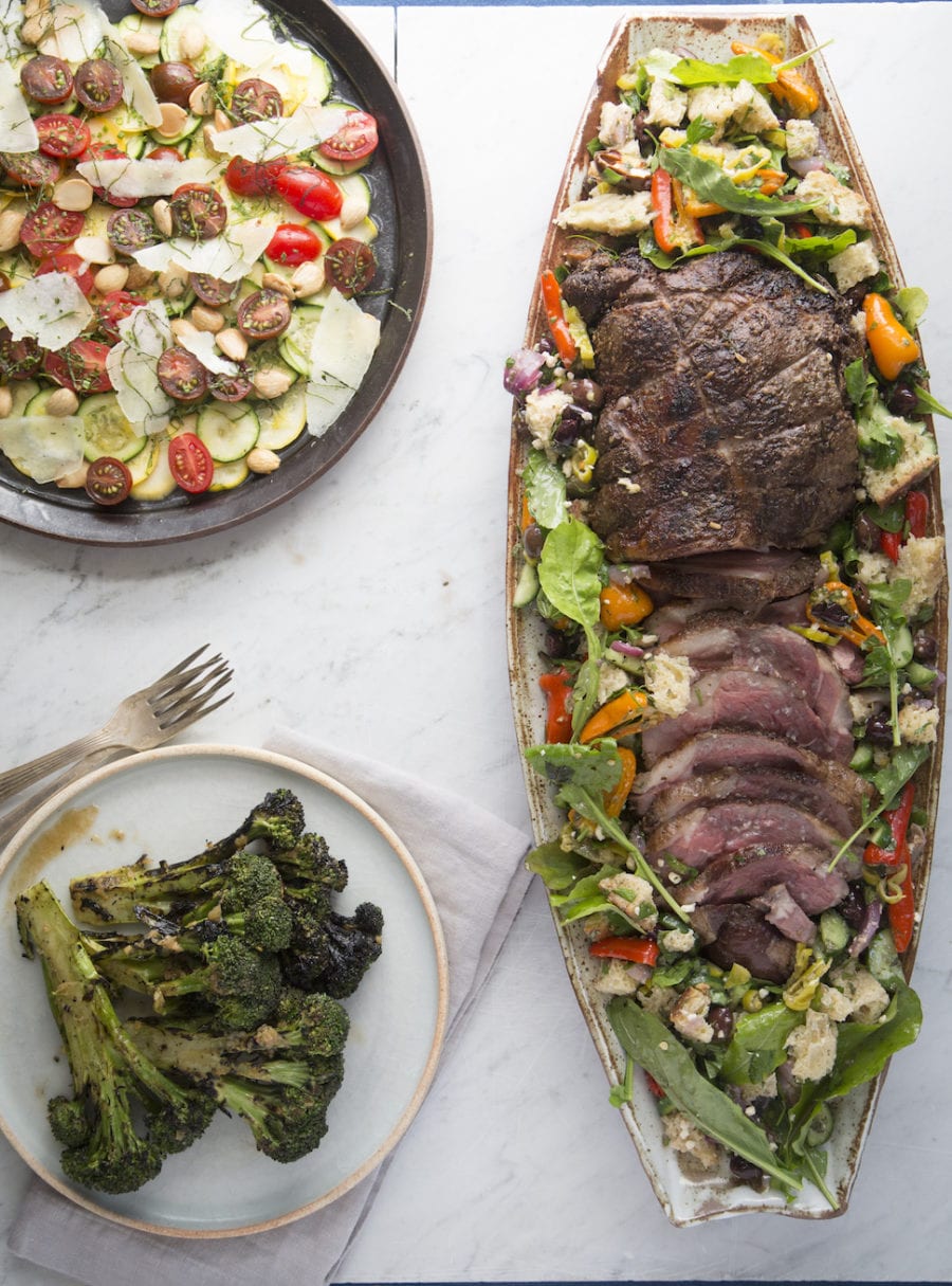Broccoli, a salad, and lamb from this dinner party menu. 
