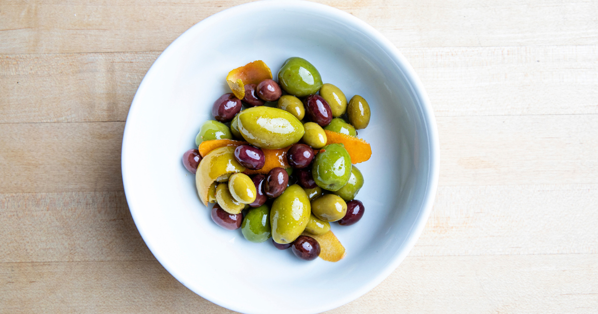 A bowl of marinated olives from Indaco