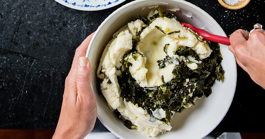 Mixing mashed potatoes colcannon