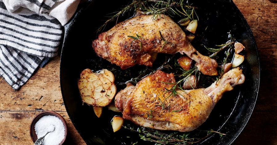 Skillet Chicken in a pan with herbs