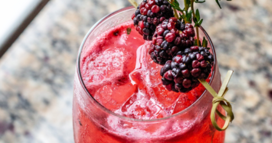 Photograph of a blackberry gin smash, a caping food