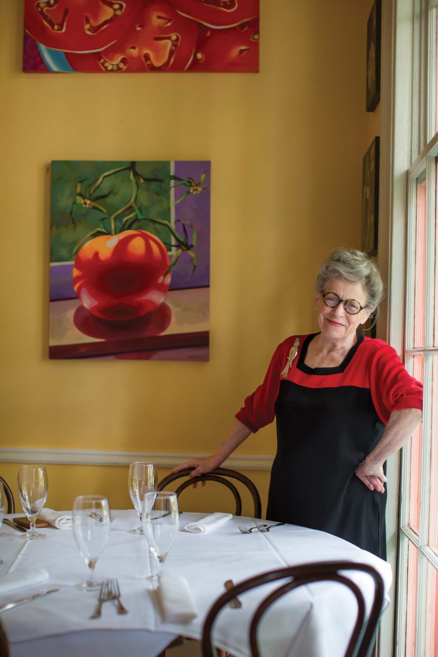 JoAnn Clevenger at the table of her New Orleans restaurant 