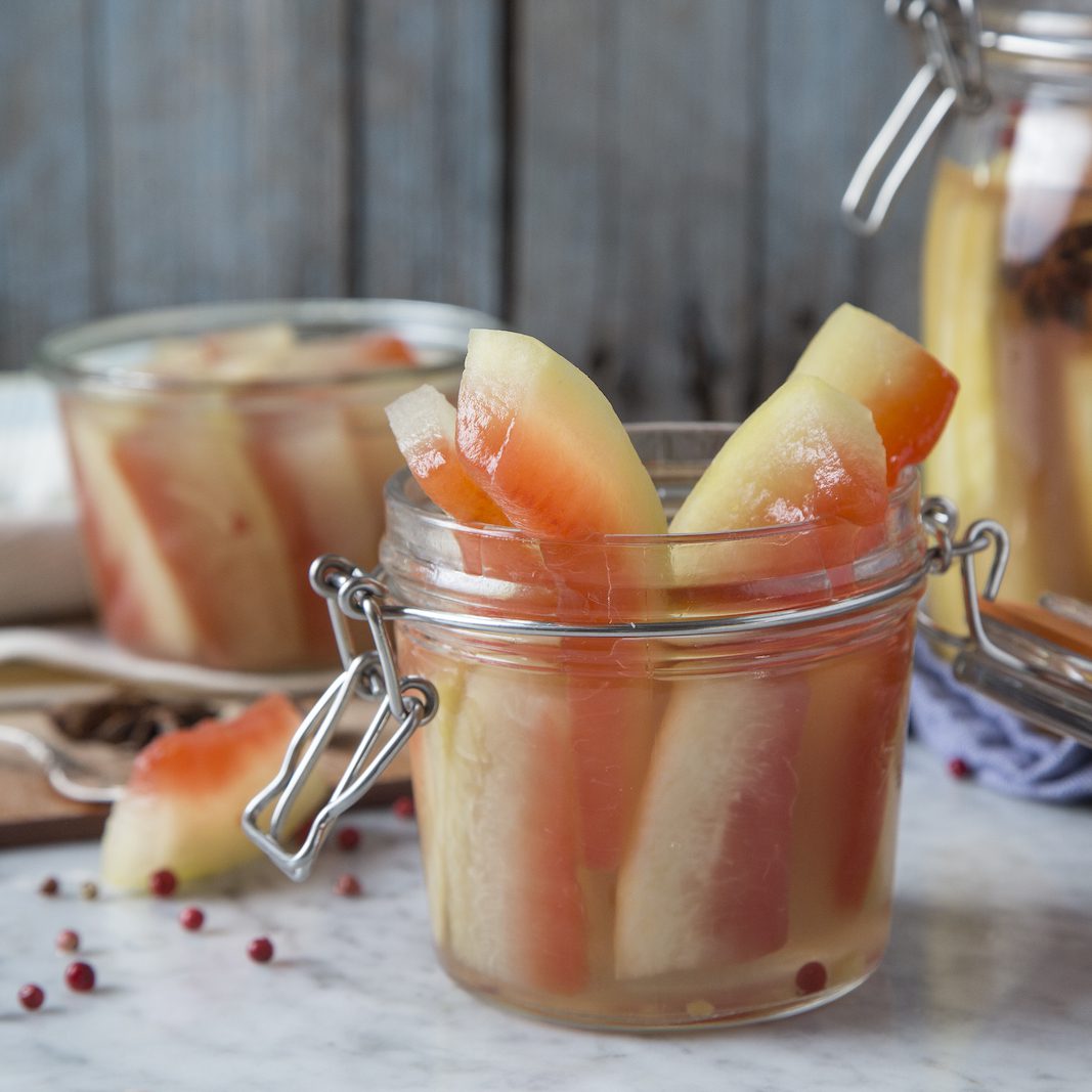 Pickled watermelon rinds in a jar.