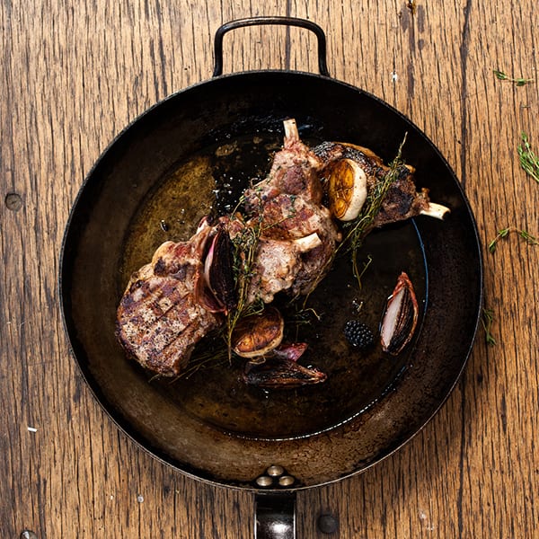 Pork chops in a cast iron skillet, one of four Father's day ideas for meals