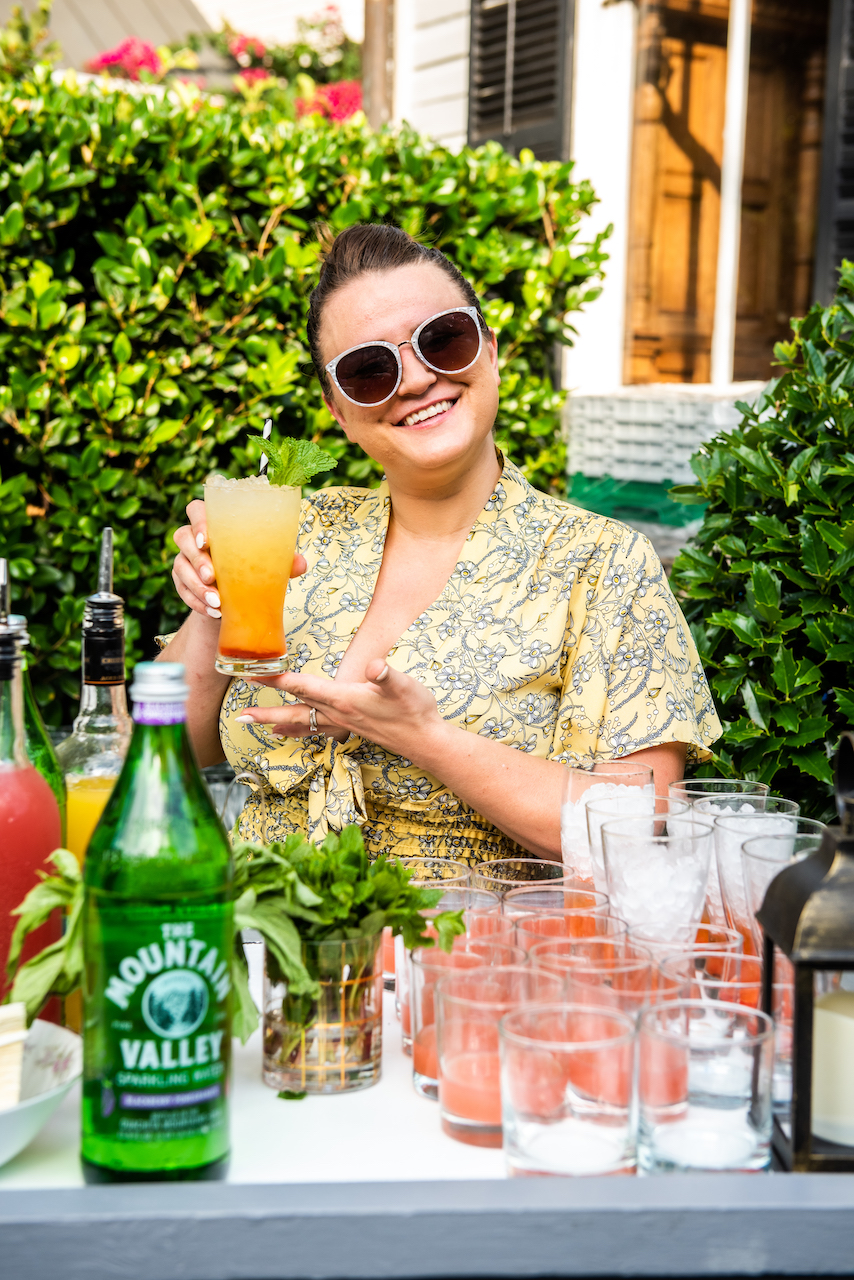 Megan Deschaine poses with one of her Mountain Valley Spring Water cocktails at Toast to Spoleto