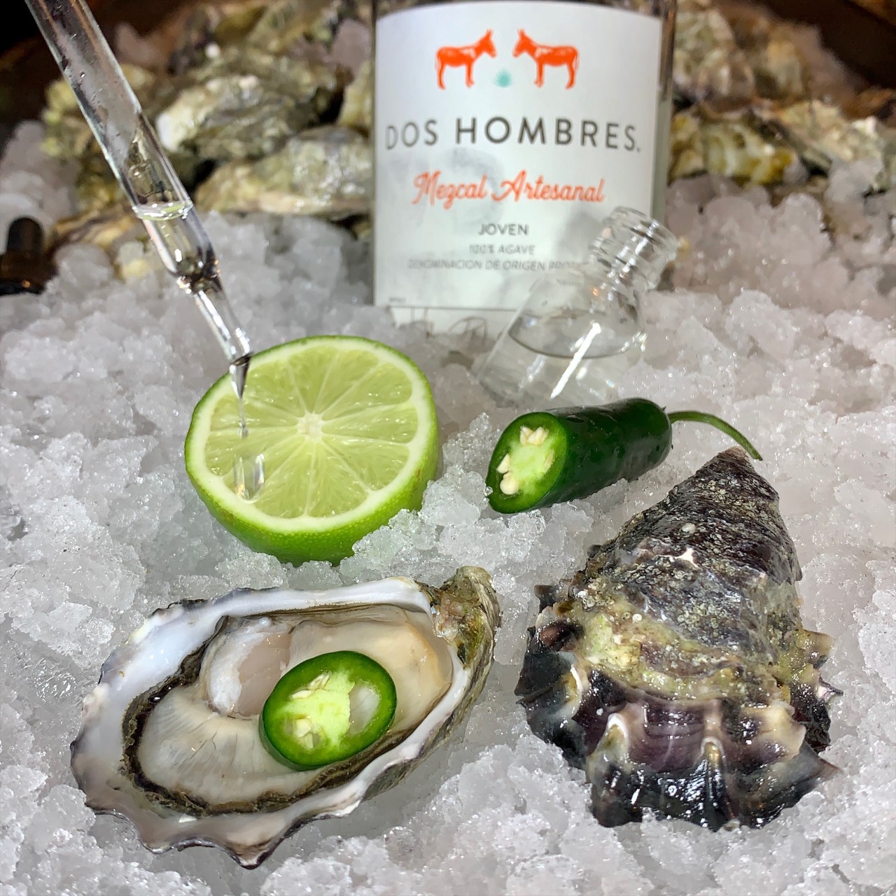 Photograph of Mezcal Jalapeno Oyster served at Raw Bar on ice