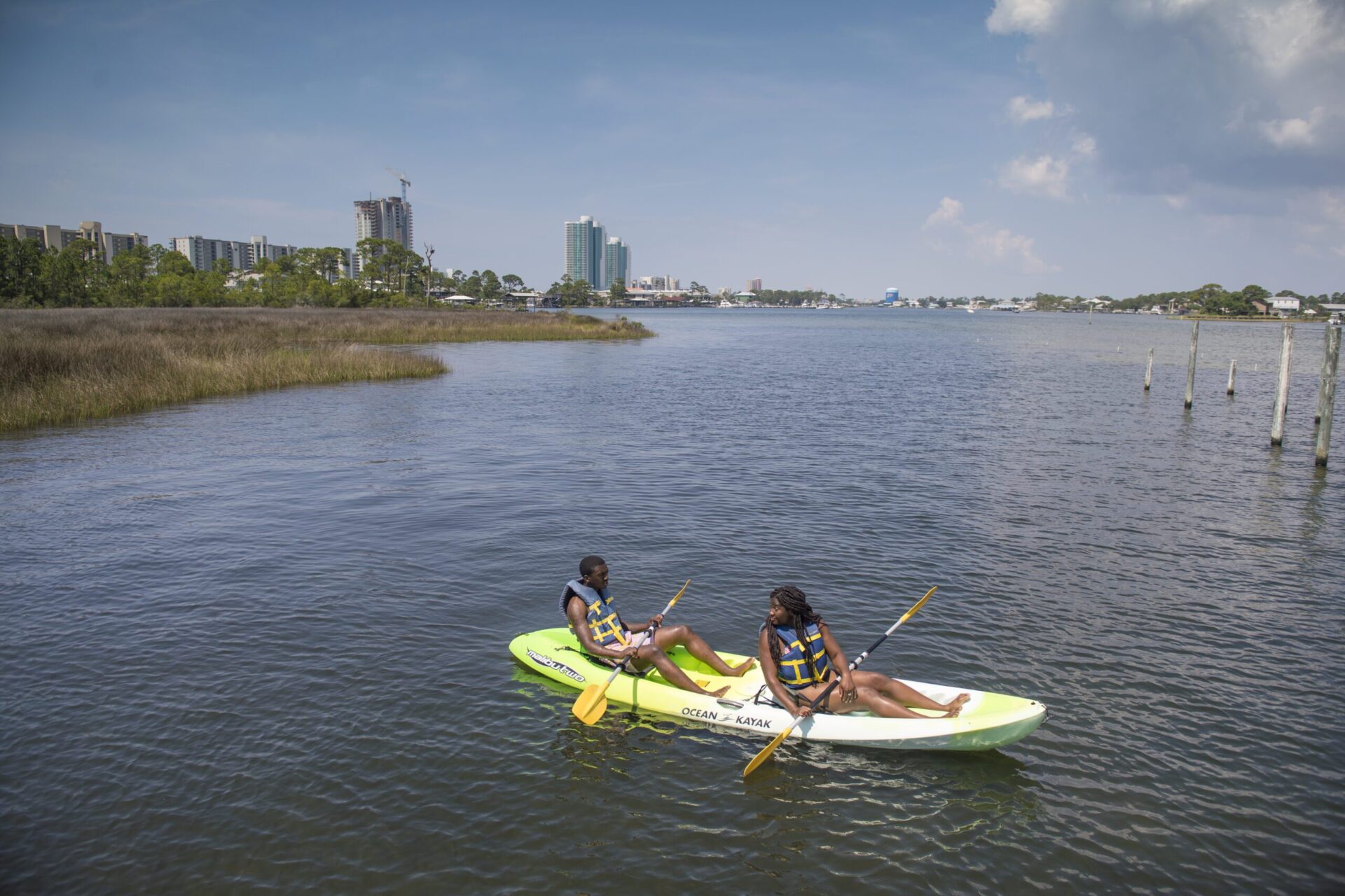 Photograph of a couple using ocean kayaks in Gulf Shores