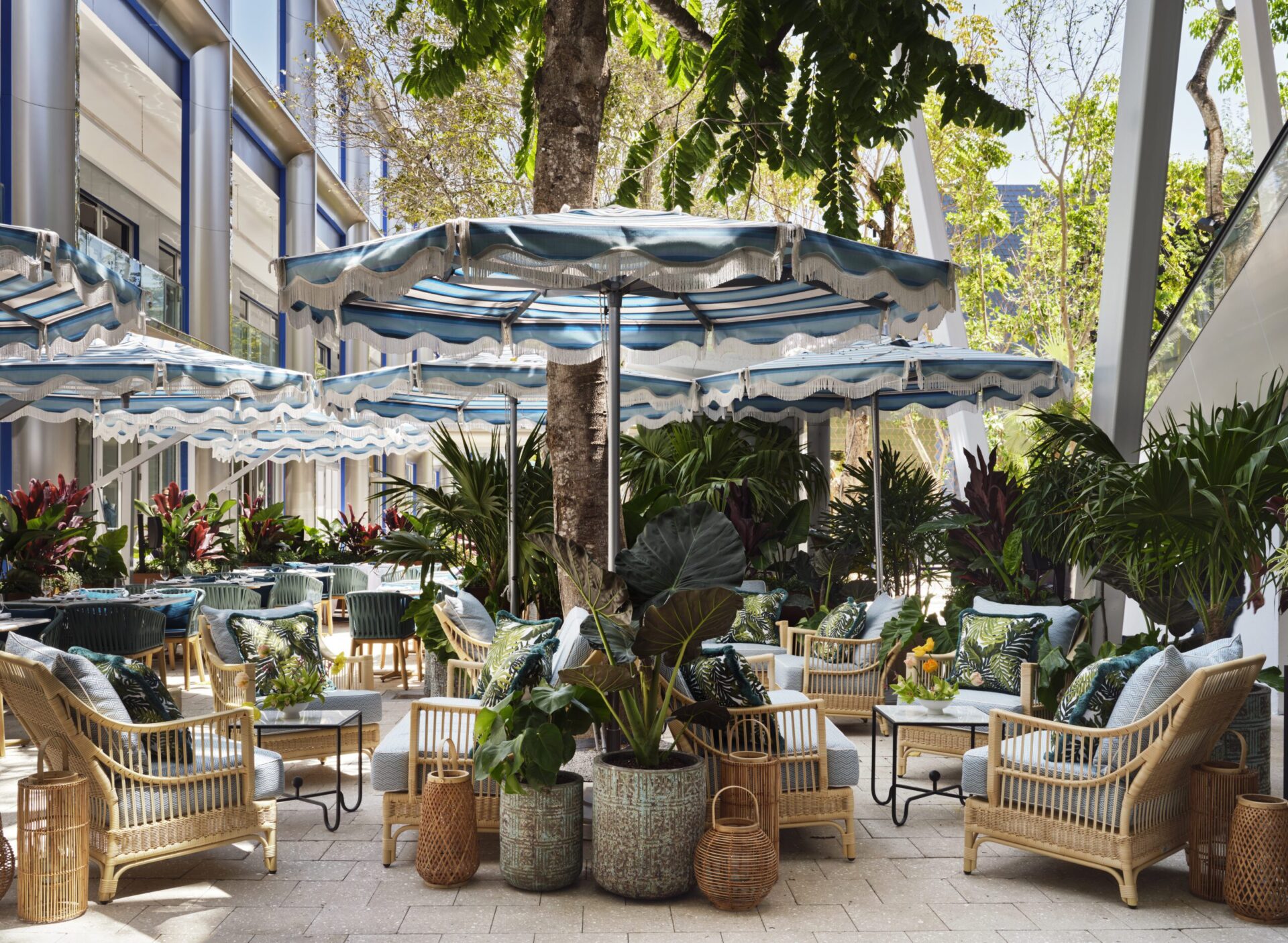 Photograph of outside patio of ZZ's Club with wooden chairs and umbrellas 
