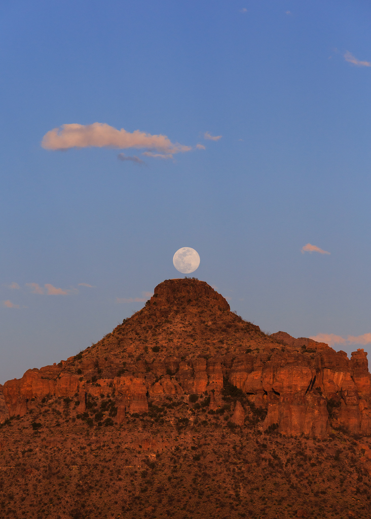 The moon rising over Big Bend Butte in Southwest Texas