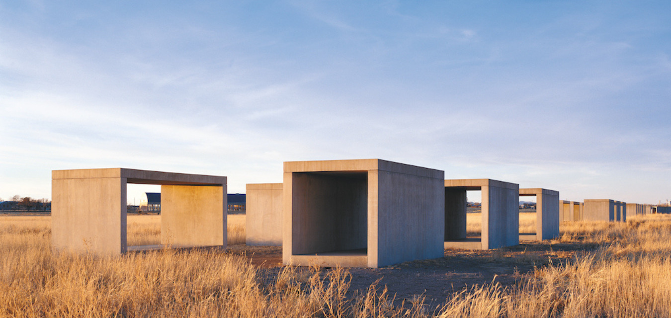 Cement boxes in a prairie field are part of the Donald Judd art installation in West Texas