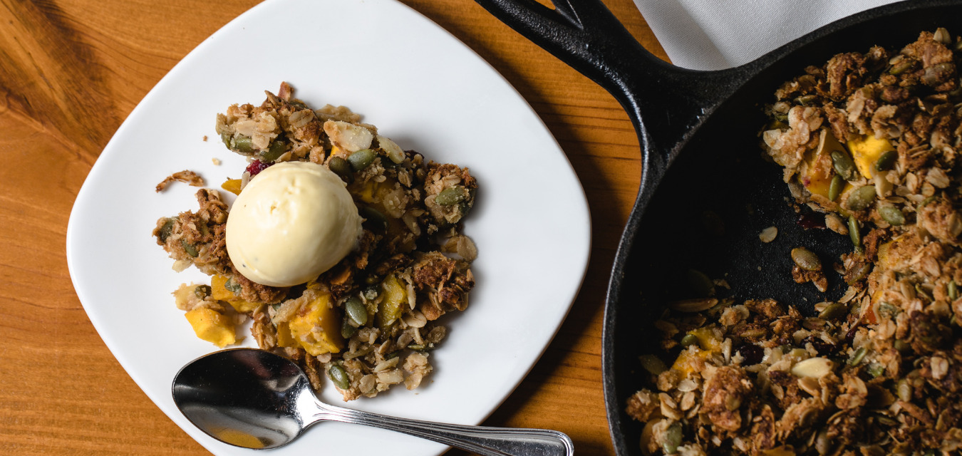 Easter Desserts,, Gluten-free mango cranberry crisp on a plate and served from a skillet