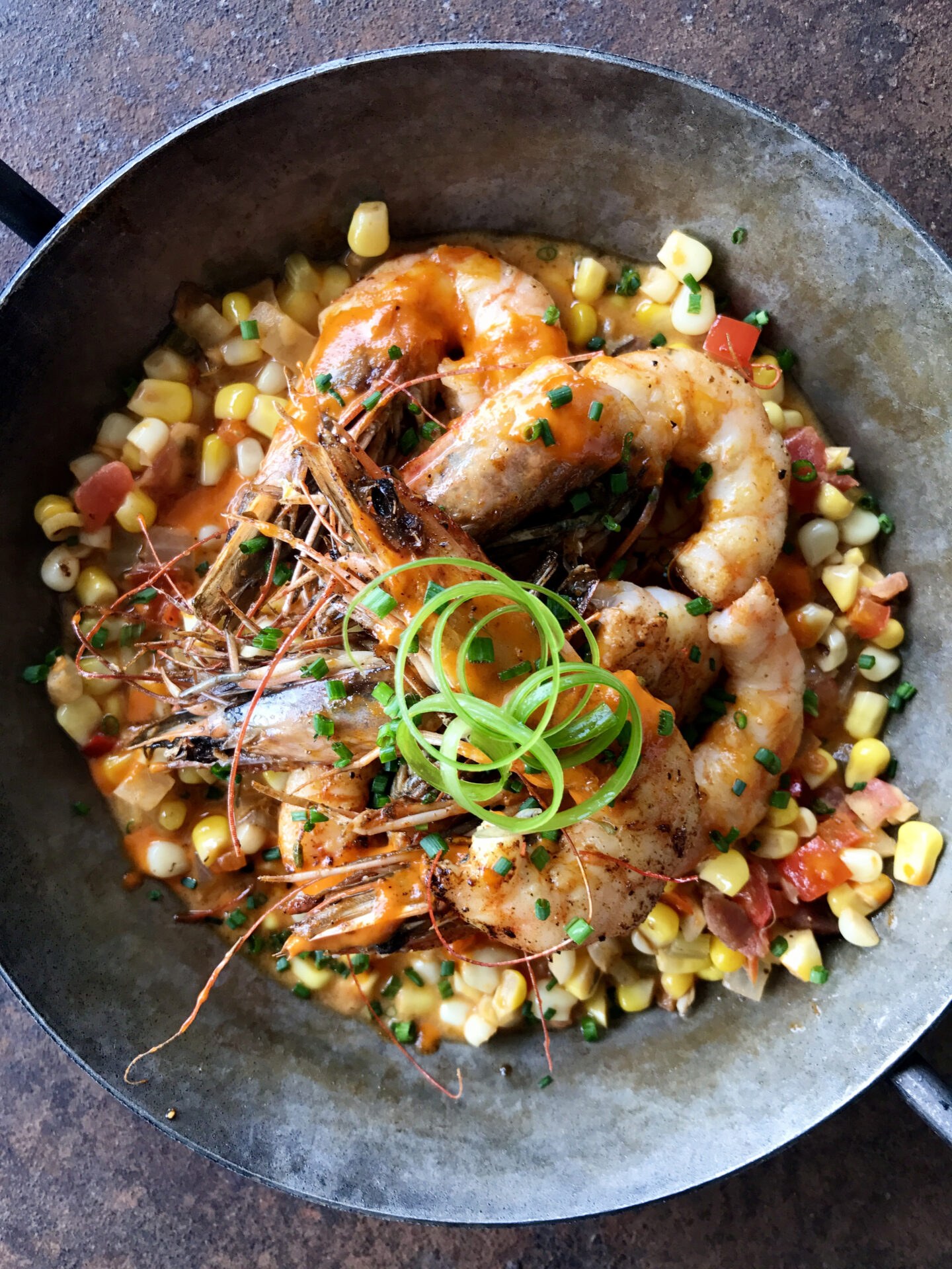A dish with shrimp and corn Snackbar