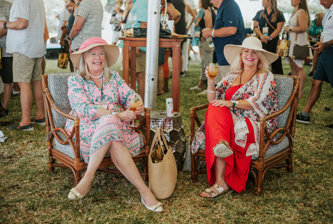 Two lovely ladies sitting in the sun at St. Augustine Food + Wine Festival