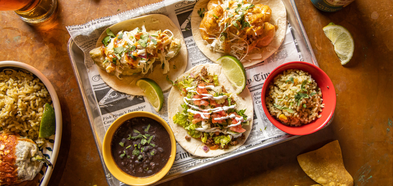 Collection of tacos on a tray in Stuff You Should Know podcaster's guide to Atlanta tacos