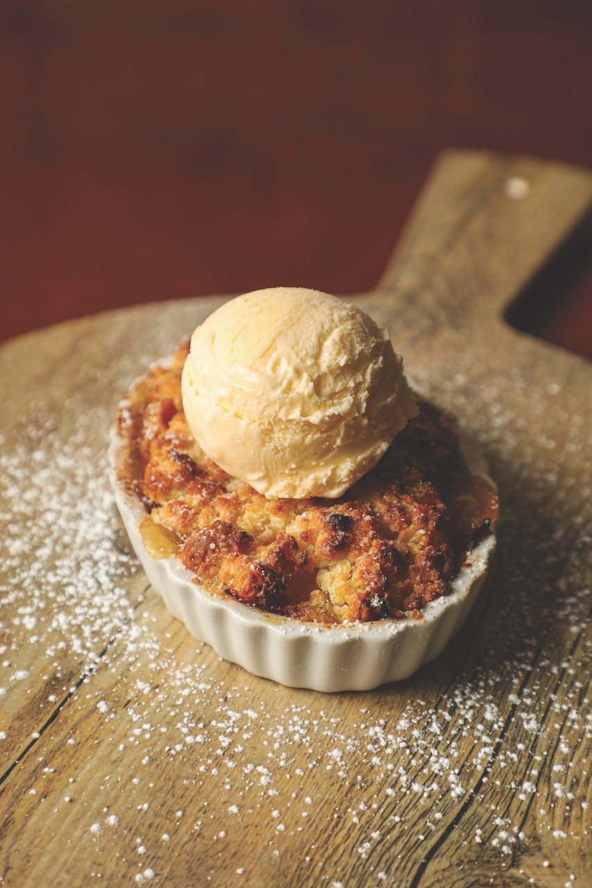 Crumble and vanilla ice cream served at Cafe Reconcile