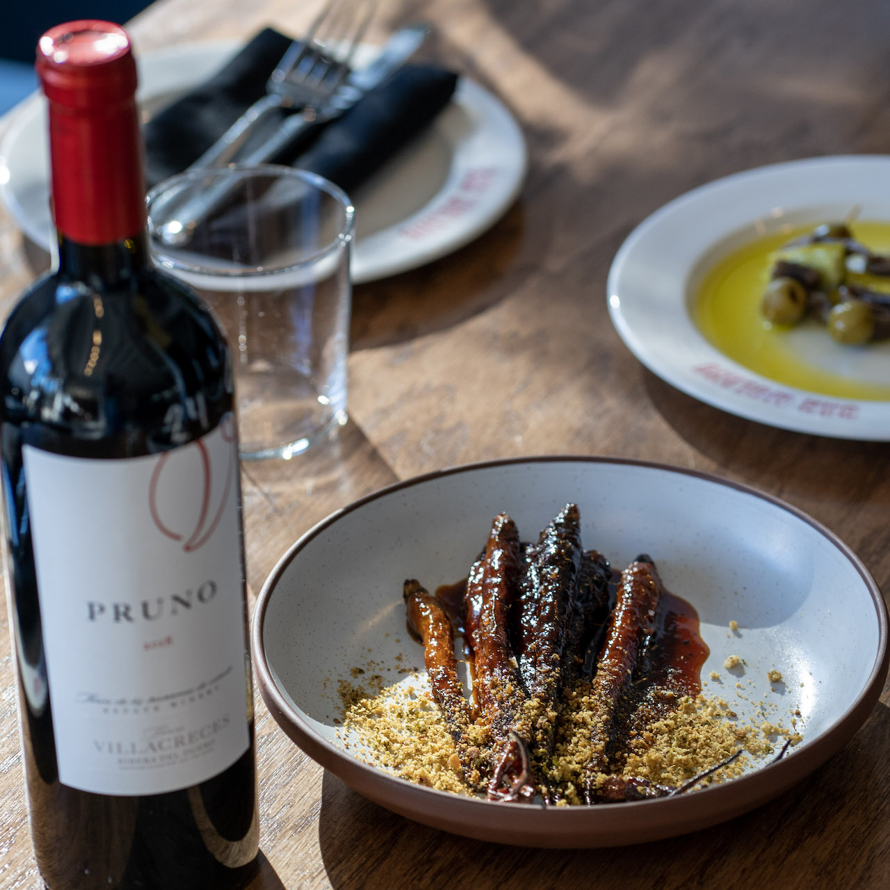 Bowl of tapas and bottle of wine at Bar Molino, one of the new restaurants in Florida