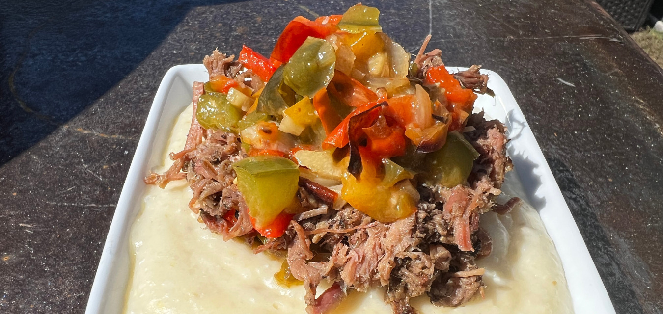 Smoked Gouda Grits with Roast Pepper Relish is one of pitmaster Rashad Jones' favorite barbecue sides