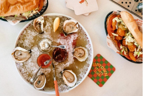 A meal of oysters and subs at Uptown Sports Club, an Austin restaurant