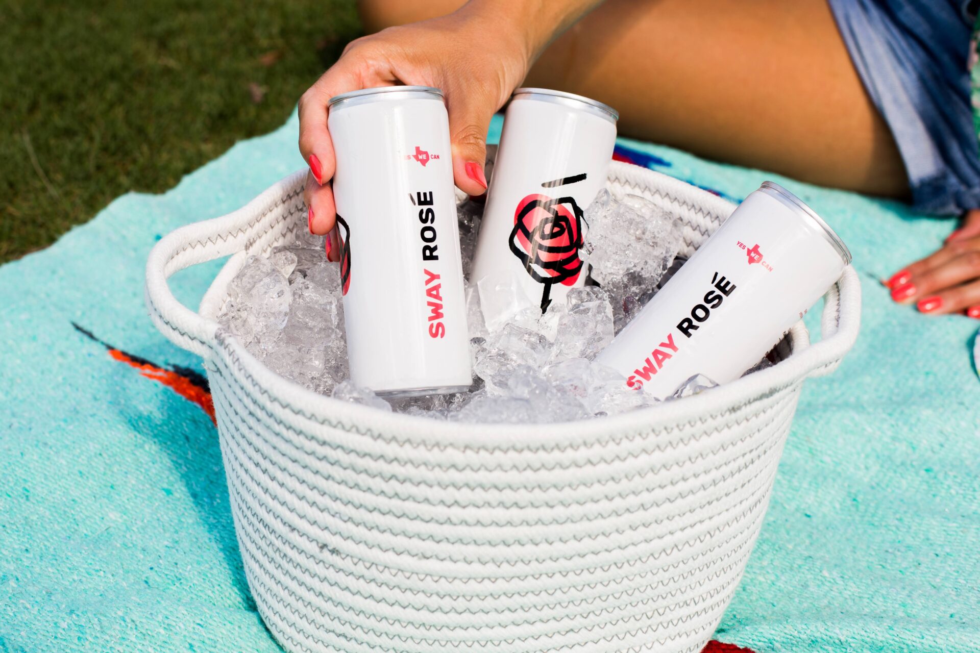 Sway Rose cans in a basket of ice, description and wine pairing offered