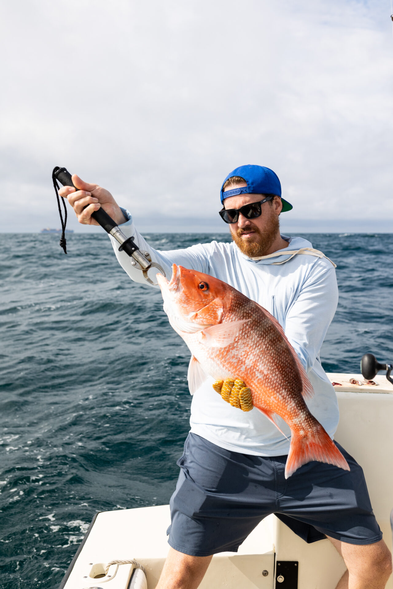 James London of Chubby Fish with a red snapper caught on a boat