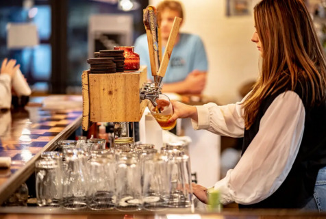 A bar tender pouring a beer at Von Blaze, one of seven featured West Virginia restaurants