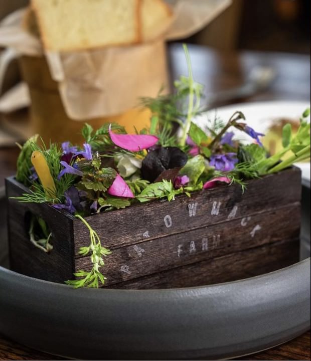 Edible Flowers in a brown crate on their way to The Restaurant at Patowmack Farm