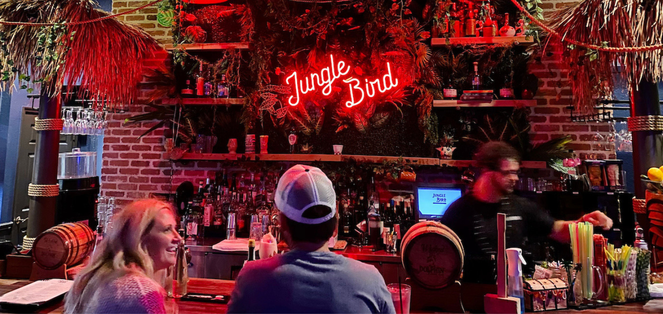 Interior of Jungle Bird Tiki with a neon sign