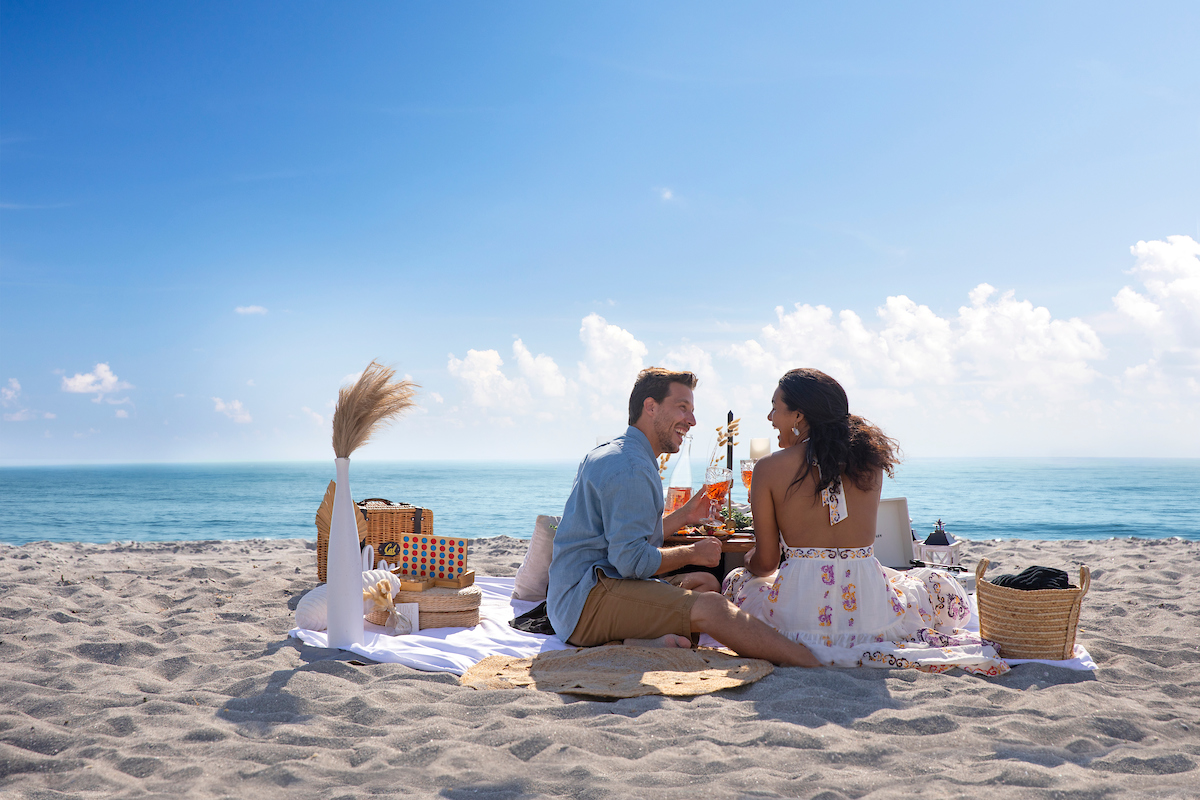 Two people enjoying a picnic on Captiva Island Beaches