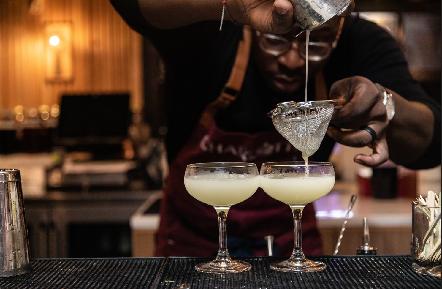 Mixologist pouring cocktails at Savor Atlanta 