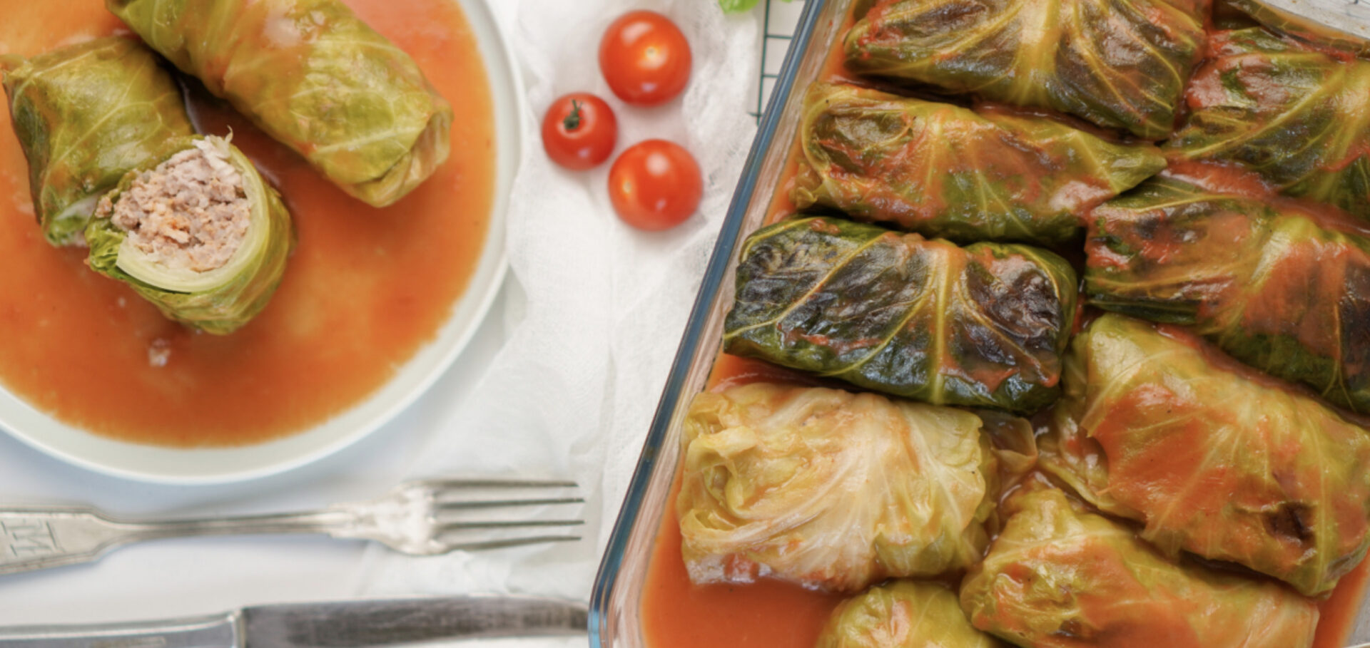 stuffed cabbage with tomatoes and onion in a large dish