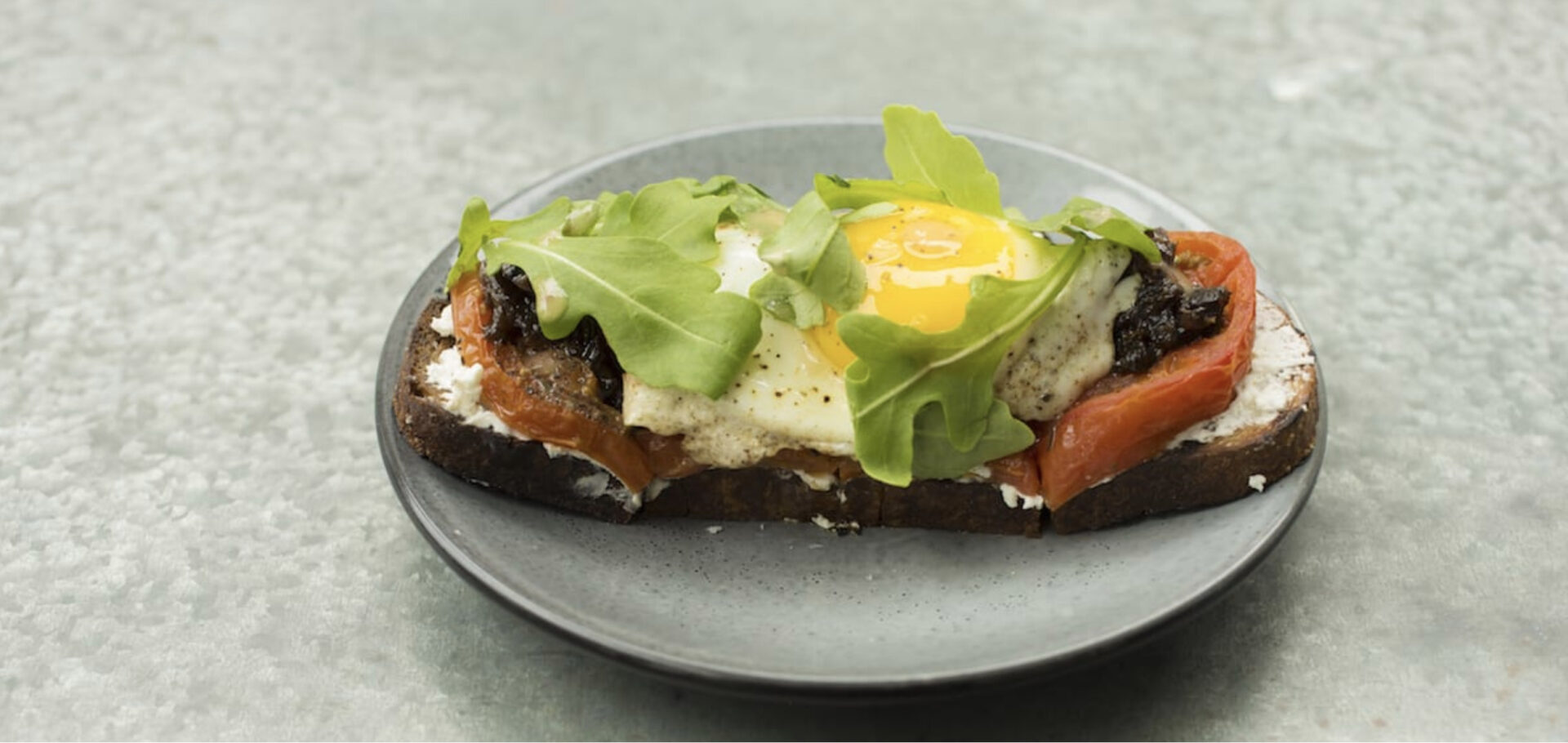 tomato toast with fried egg and bacon marmalade