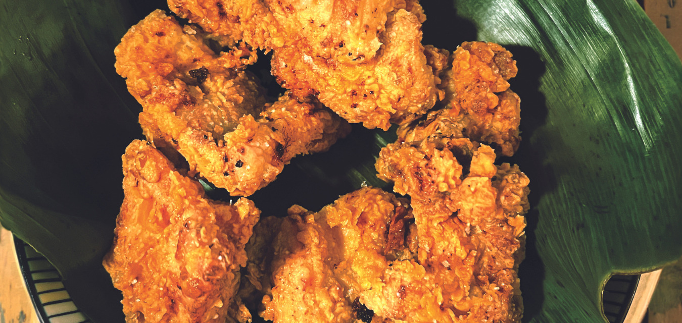 Chef Sam Fore’s fried chicken is topped with zesty curry leaf salt and turmeric