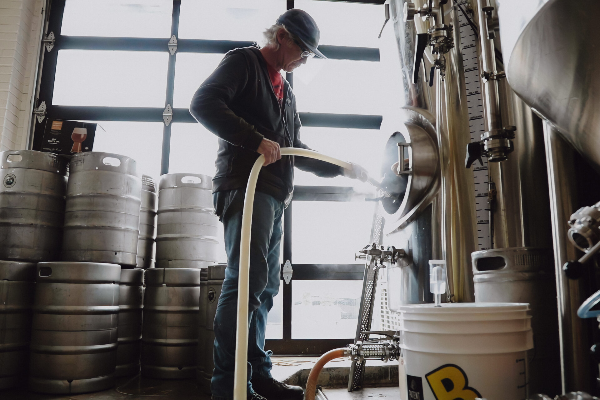 Man working with the brewery kegs at Streetcar 82. 