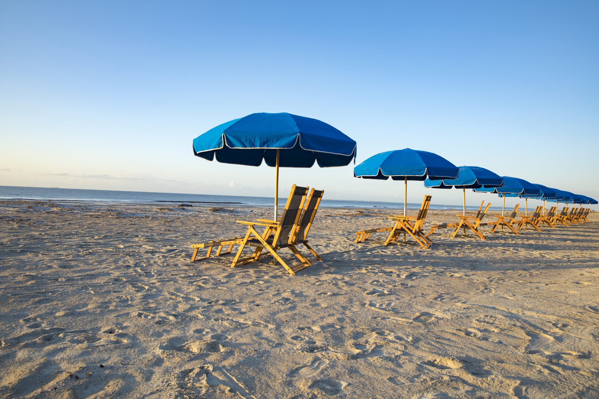 Chairs on the beach with umbrellas at Hilton Head