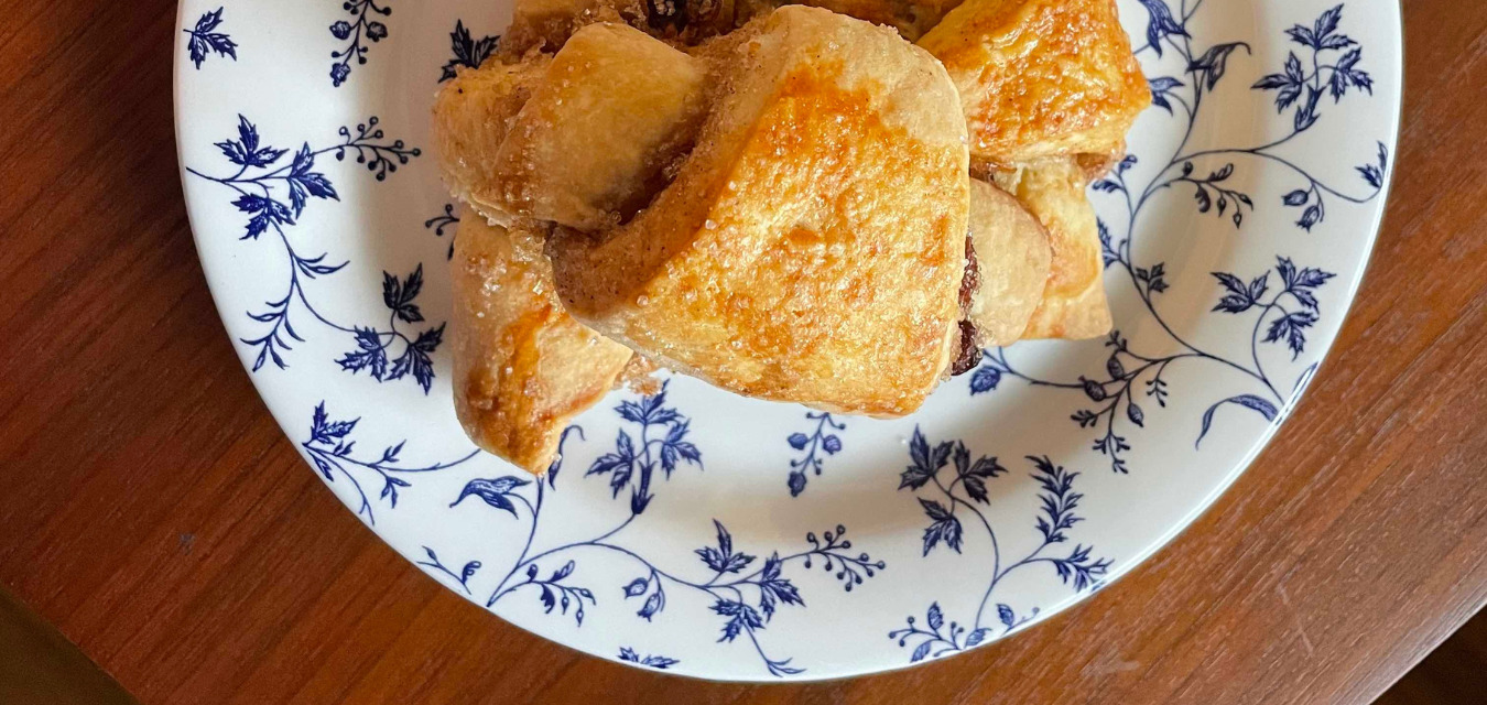 Rugelach from Kugels & Collards on a flowered blue plate